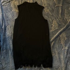 Simply Noel Black dress with tassels details at the bottom.